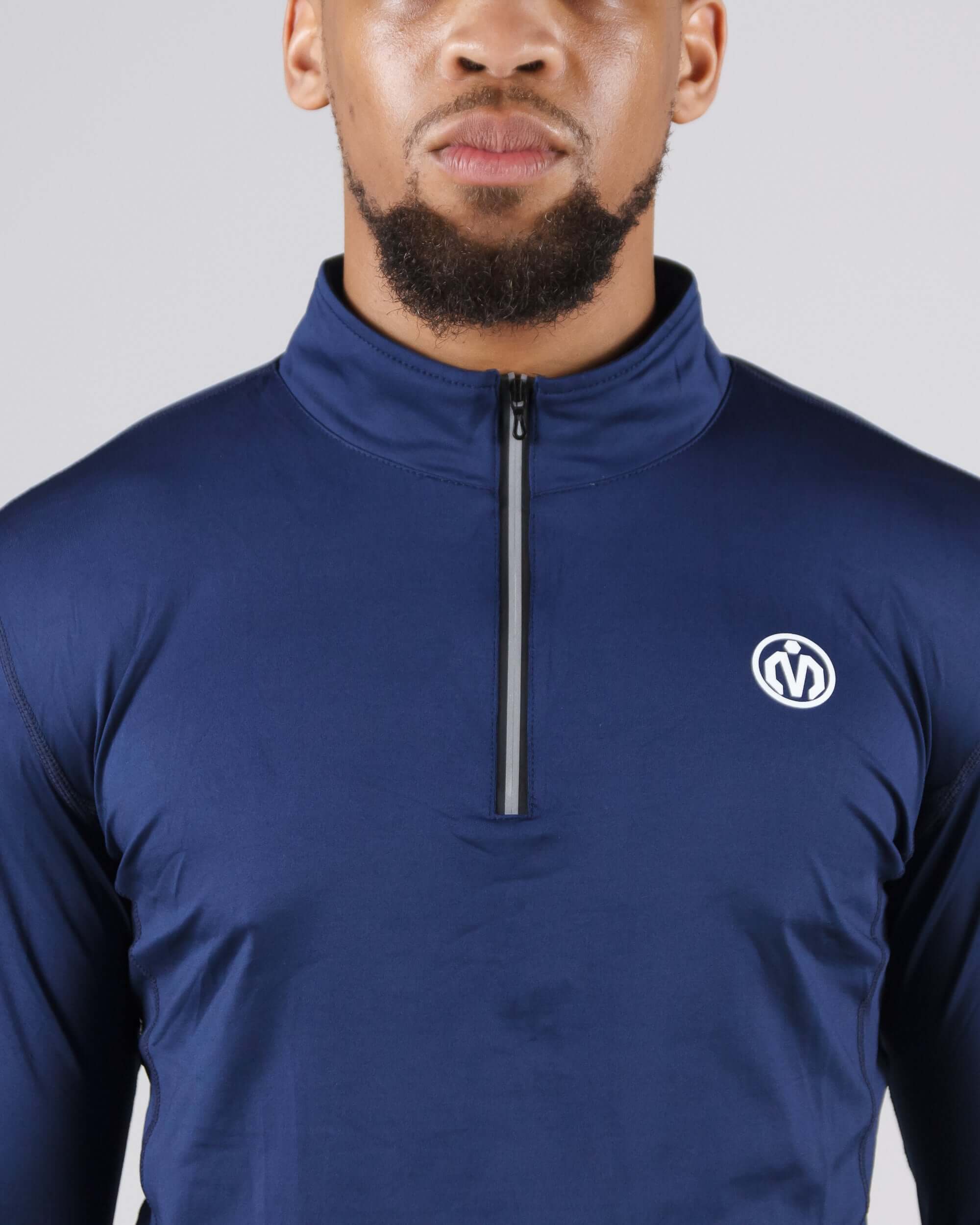 Navy blue Pinnacle Dry-Fit Long Sleeve Half Zip Training Top on male model for gym and outdoor workouts