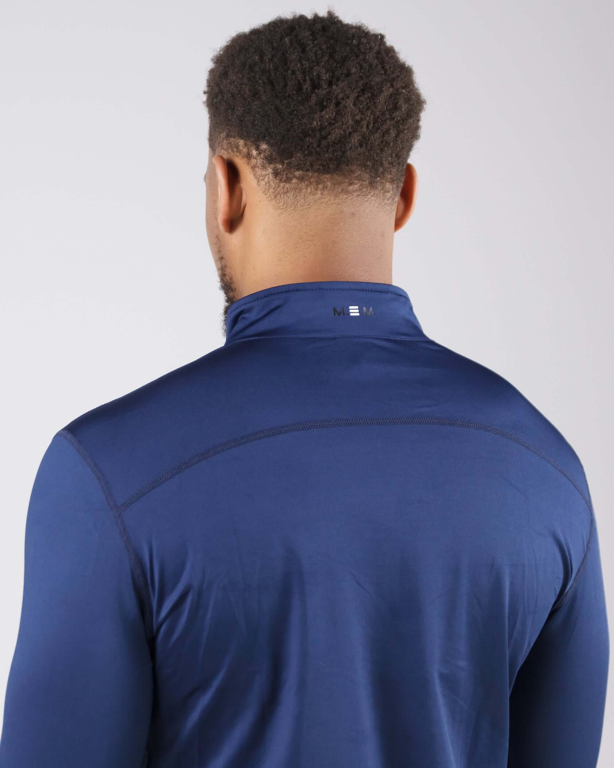 Back view of man wearing navy blue Pinnacle Dry-Fit Long Sleeve Half Zip Training Top