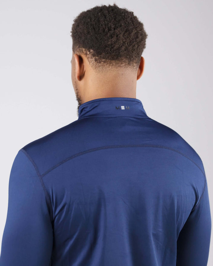 Back view of man wearing navy blue Pinnacle Dry-Fit Long Sleeve Half Zip Training Top