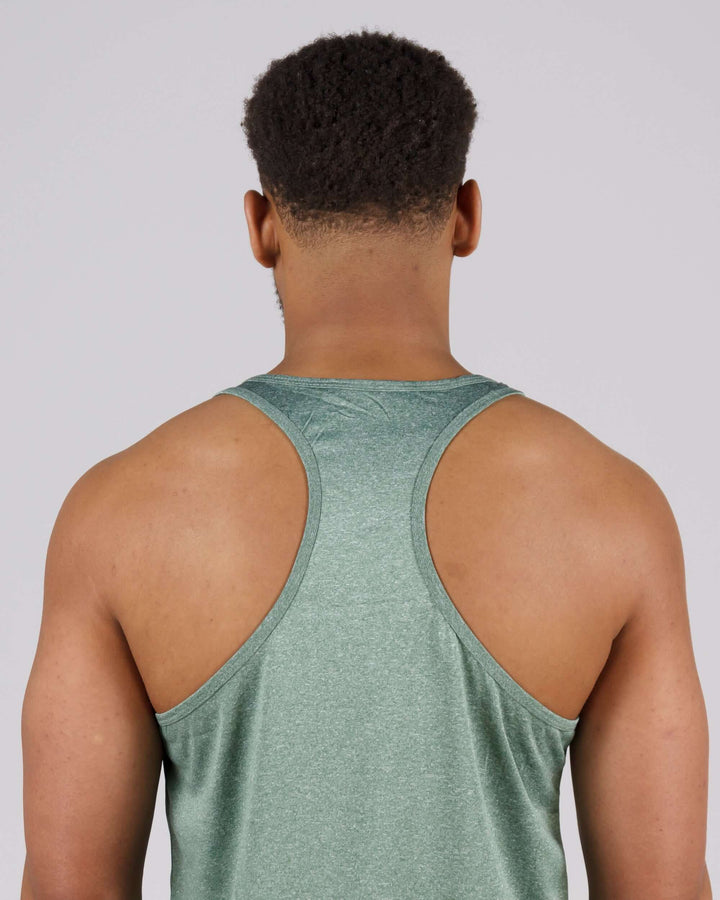 Back view of man wearing light green Pinnacle Slim Fit Tank Top, showcasing racerback design and premium fabric.