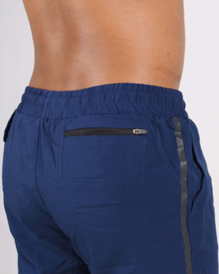 Back view of navy blue Pinnacle Dry-Fit 2-in-1 Shorts with black zipper pocket, showcasing premium athleticwear design.