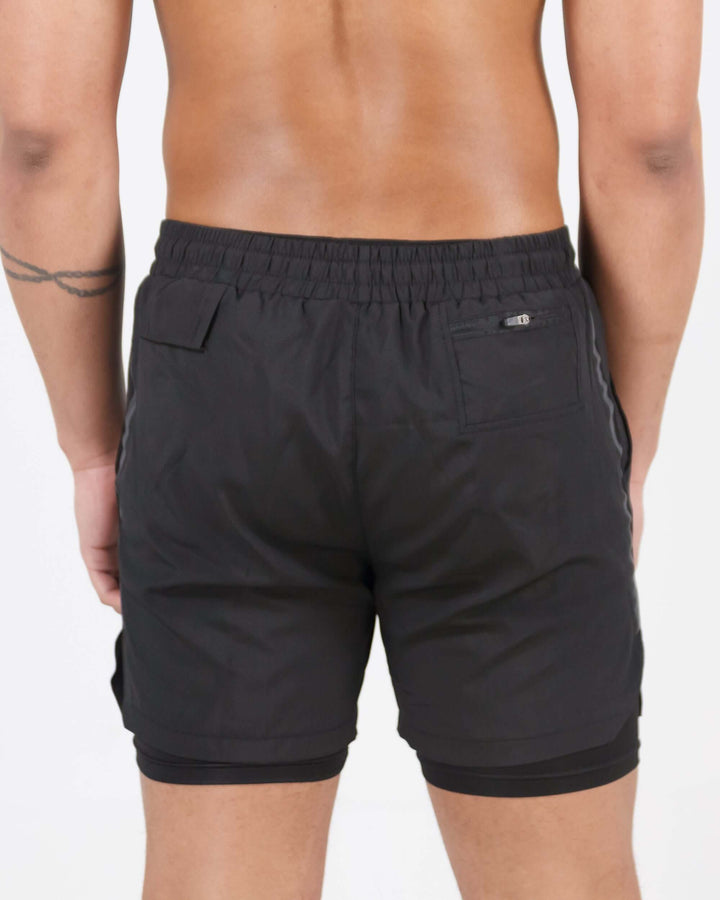 Back view of Pinnacle Dry-Fit 2-in-1 Shorts in black showing innovative compression support design.